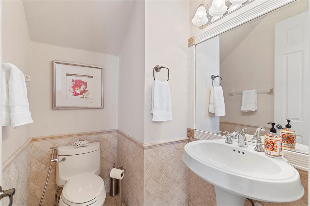 4622 Southwest 185th Avenue Miramar, FL 33029 - Photo 25 of 64 a bathroom with a toilet sink and mirror