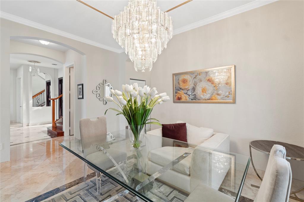 4622 Southwest 185th Avenue Miramar, FL 33029 - Photo 27 of 64 a dining room with furniture and a chandelier