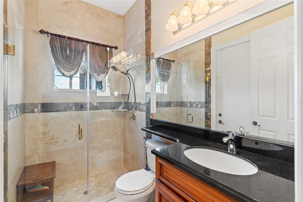 4622 Southwest 185th Avenue Miramar, FL 33029 - Photo 33 of 64 a bathroom with a sink a toilet and shower