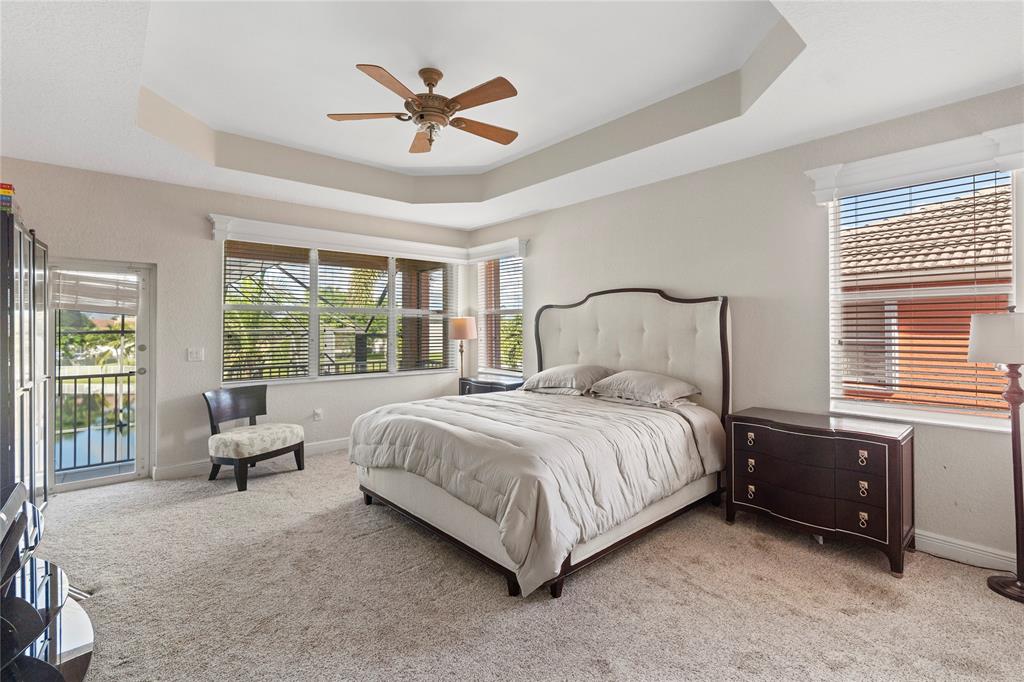 4622 Southwest 185th Avenue Miramar, FL 33029 - Photo 41 of 64 a bedroom with a bed a couch and a large window