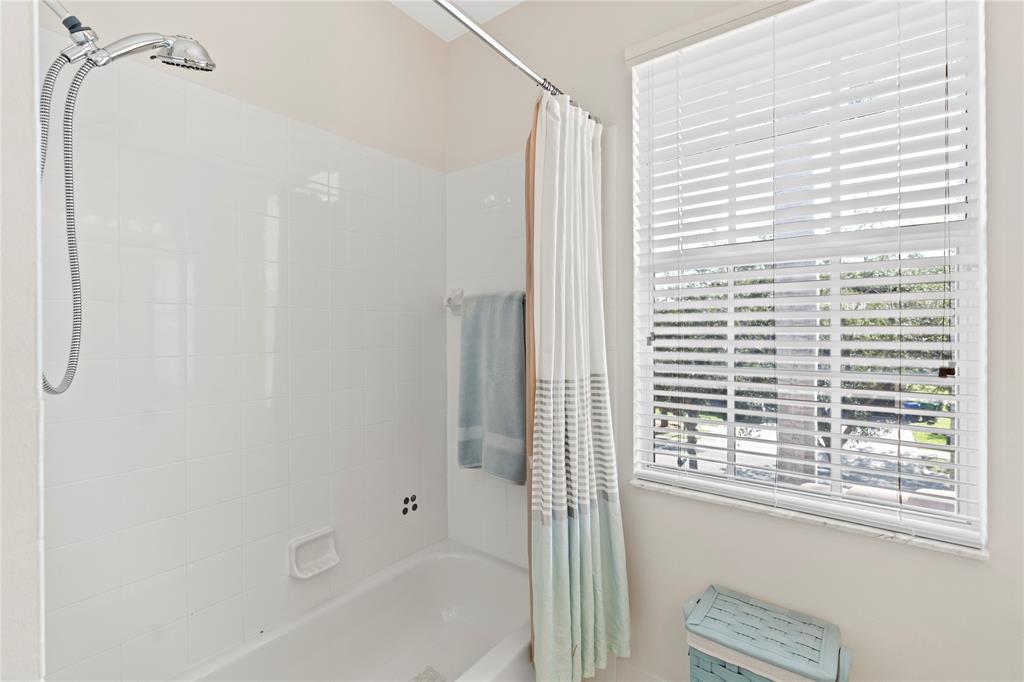 4622 Southwest 185th Avenue Miramar, FL 33029 - Photo 50 of 64 a bathroom with a bathtub and a shower