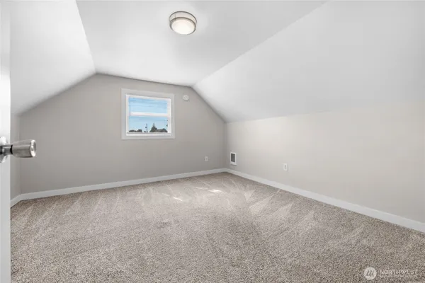 an empty room with a empty space and window