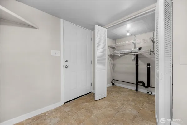 a view of a room with a refrigerator