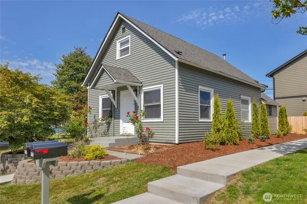 a front view of a house with garden