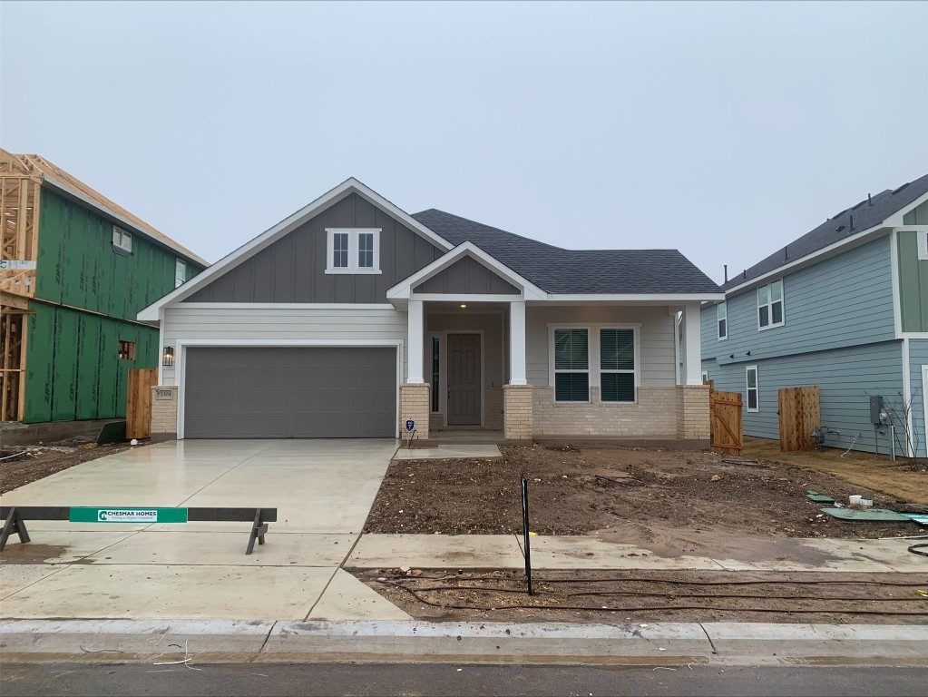 a front view of a house with garage