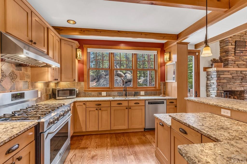 10 Robert Road Rye, CO 81069 - Photo 19 of 102 a kitchen with a stove a sink and a refrigerator