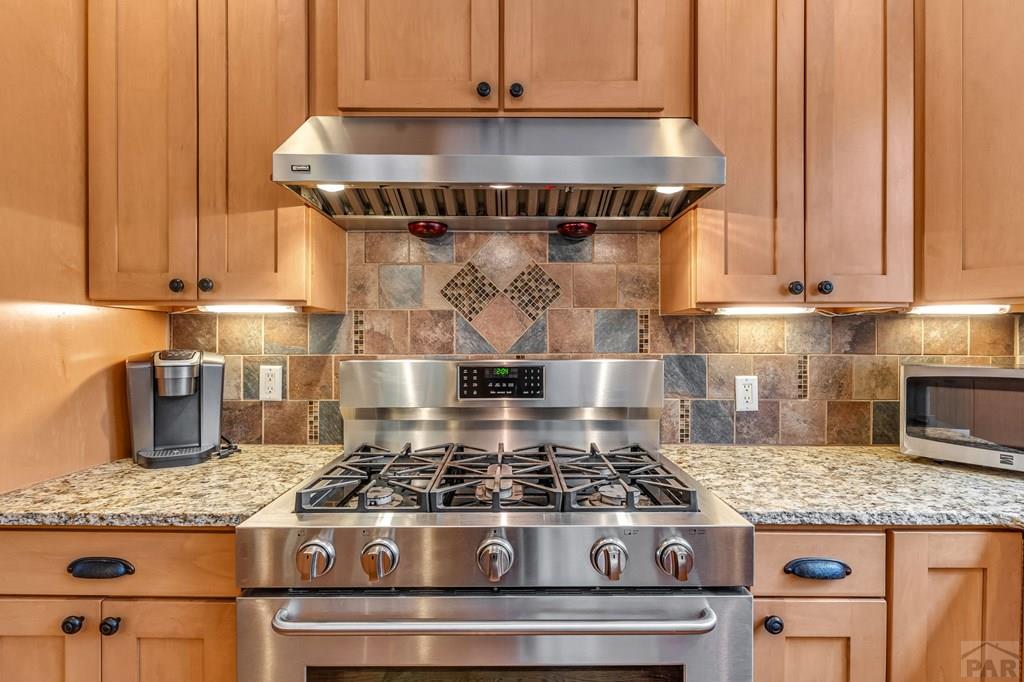 10 Robert Road Rye, CO 81069 - Photo 20 of 102 a stove top oven sitting inside of a kitchen