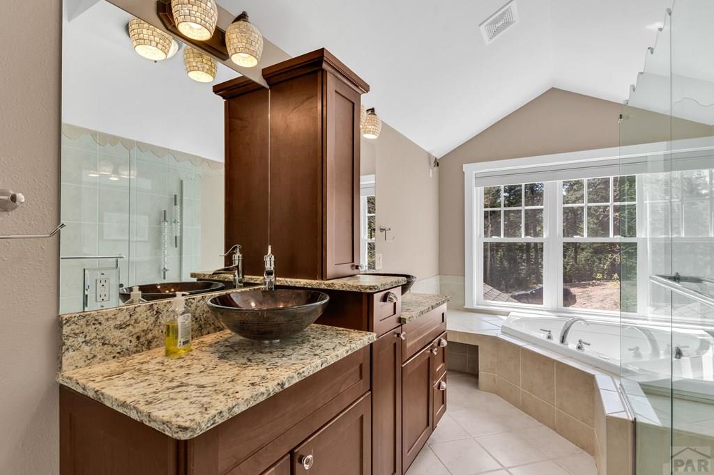 10 Robert Road Rye, CO 81069 - Photo 53 of 102 a bathroom with a granite countertop sink and a large mirror