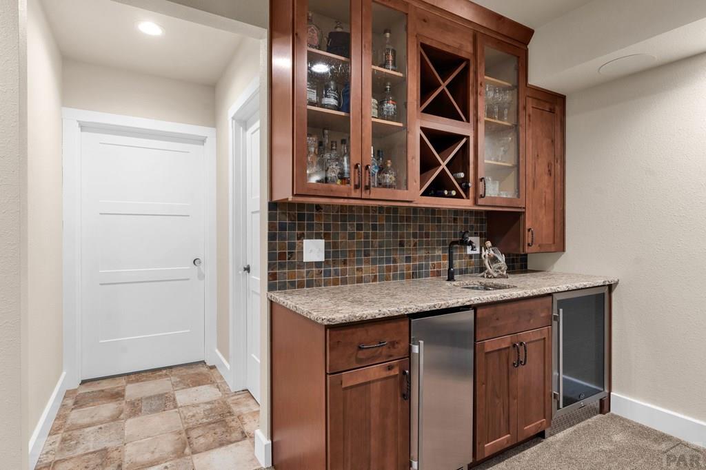 10 Robert Road Rye, CO 81069 - Photo 62 of 102 a bathroom with a granite countertop sink and a mirror