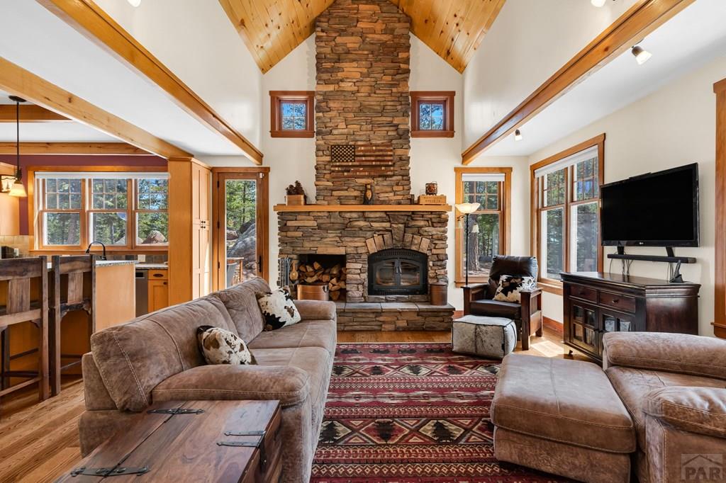 10 Robert Road Rye, CO 81069 - Photo 8 of 102 a living room with furniture a flat screen tv and a fireplace