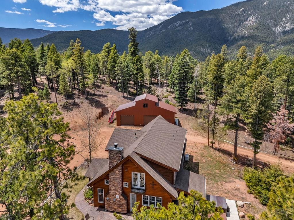 10 Robert Road Rye, CO 81069 - Photo 84 of 102 an aerial view of a house with a yard and mountain view in back