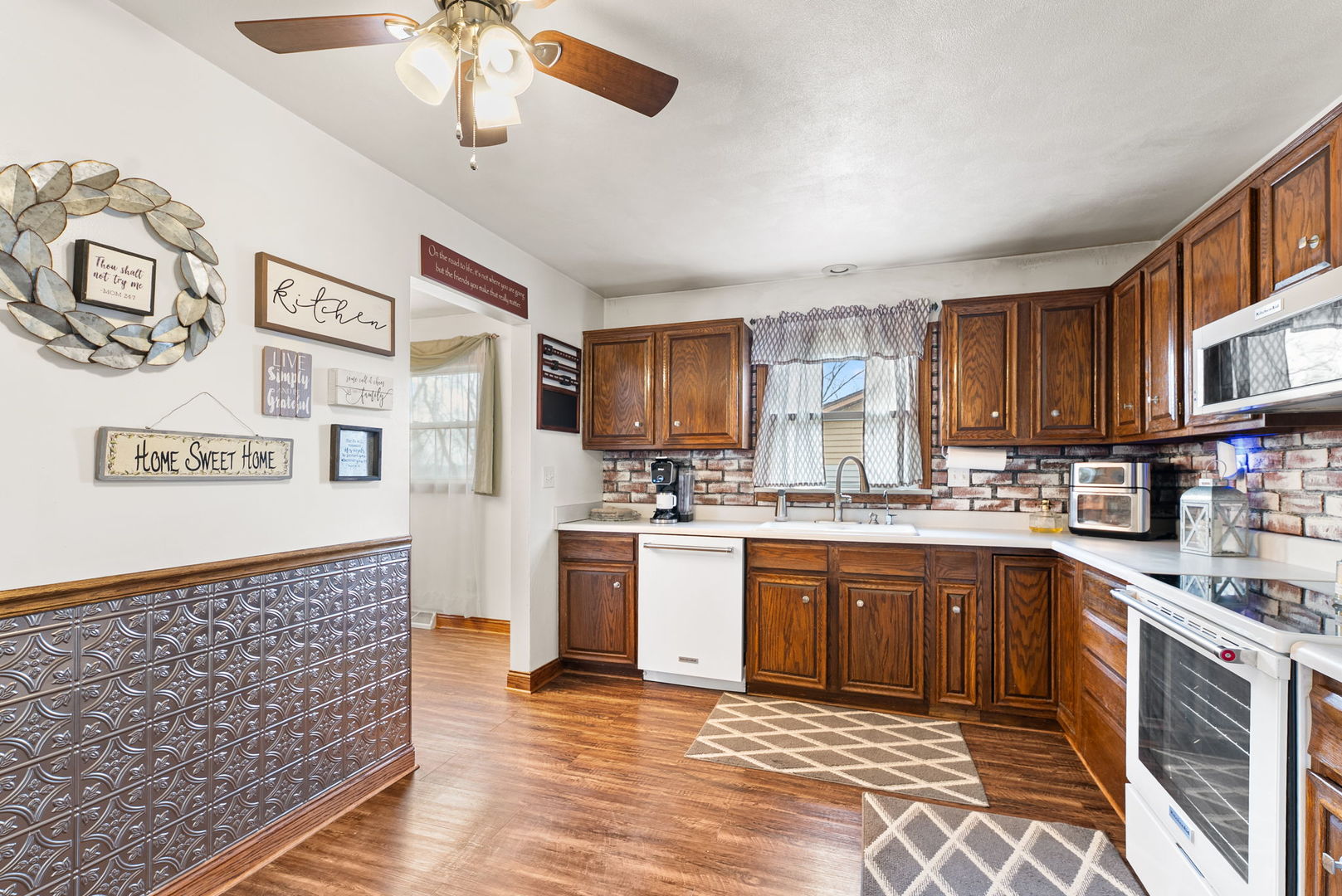 110 Andrea Court Cleveland, IL 61241 - Photo 10 of 23 a kitchen with stainless steel appliances granite countertop a sink and cabinets