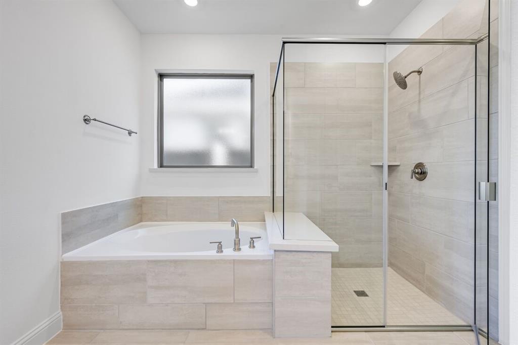 614 Bull Street Oak Point, TX 75068 - Photo 13 of 36 a bathroom with a bathtub and a shower