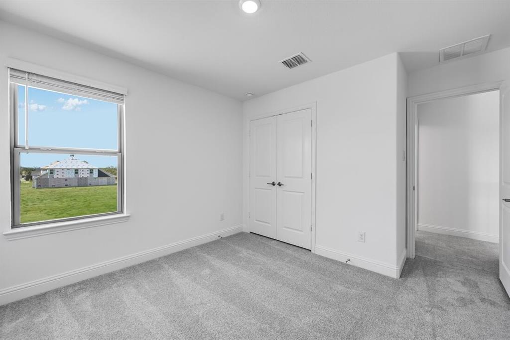 614 Bull Street Oak Point, TX 75068 - Photo 21 of 36 an empty room with a window