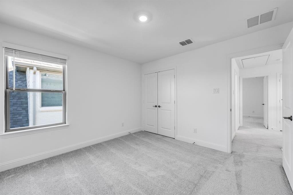 614 Bull Street Oak Point, TX 75068 - Photo 22 of 36 a view of an empty room with a window