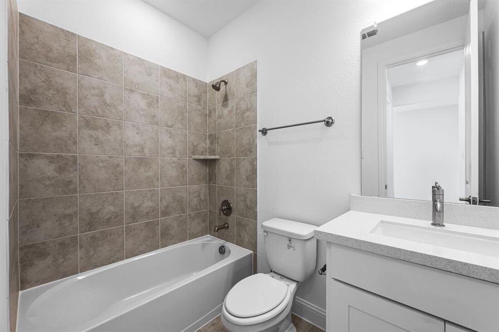614 Bull Street Oak Point, TX 75068 - Photo 24 of 36 a bathroom with a sink toilet and shower