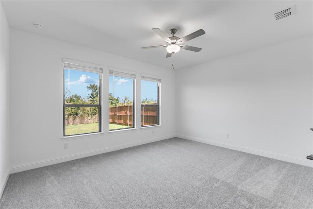 614 Bull Street Oak Point, TX 75068 - Photo 10 of 36 a view of an empty room with a window