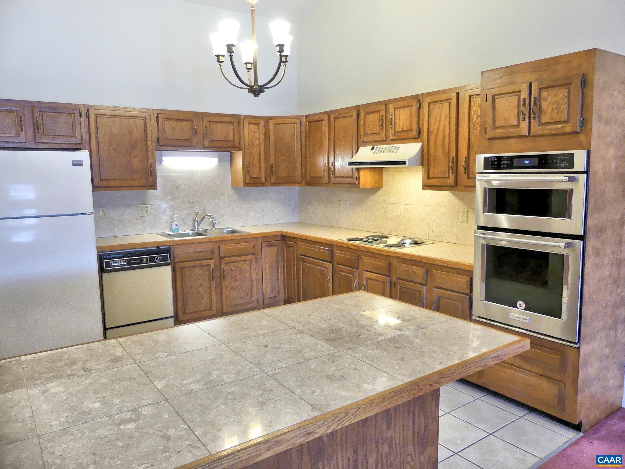 2 Marina Point Palmyra, VA 22963 - Photo 12 of 32 a kitchen with stainless steel appliances a stove a sink and a refrigerator
