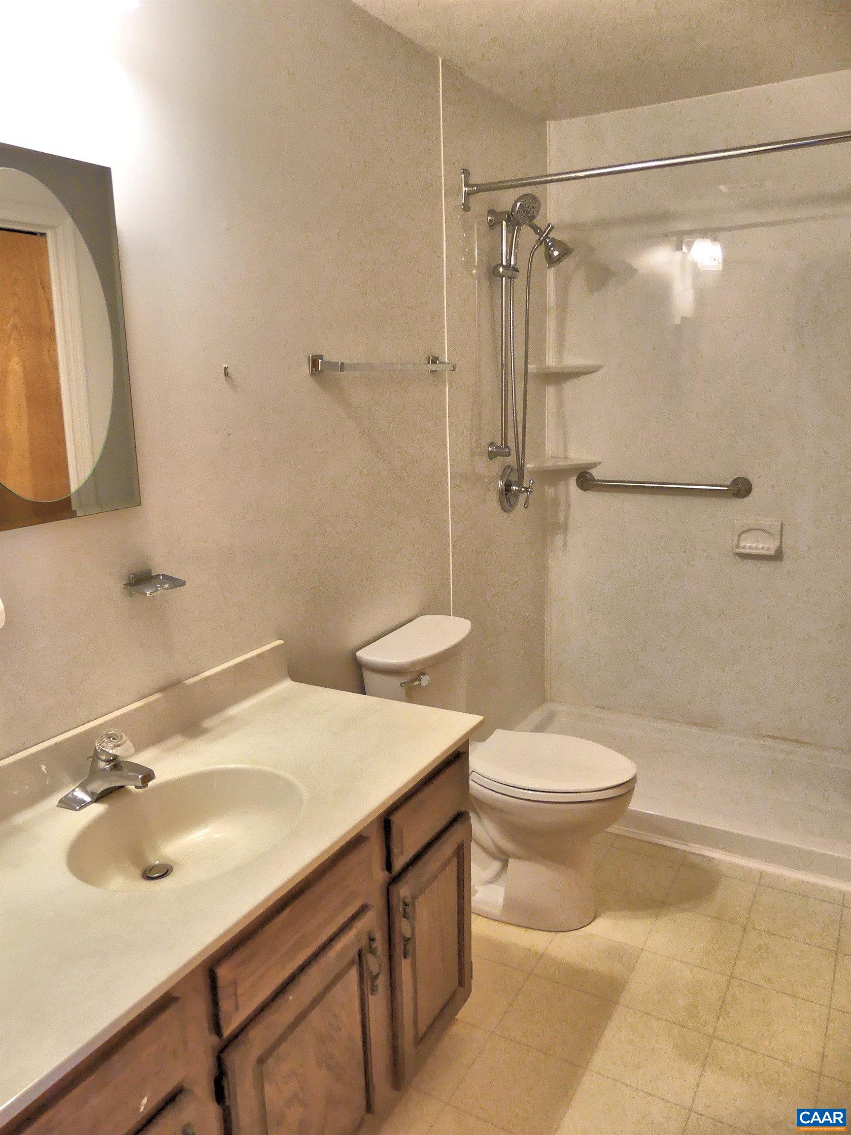2 Marina Point Palmyra, VA 22963 - Photo 16 of 32 a bathroom with a sink toilet and shower