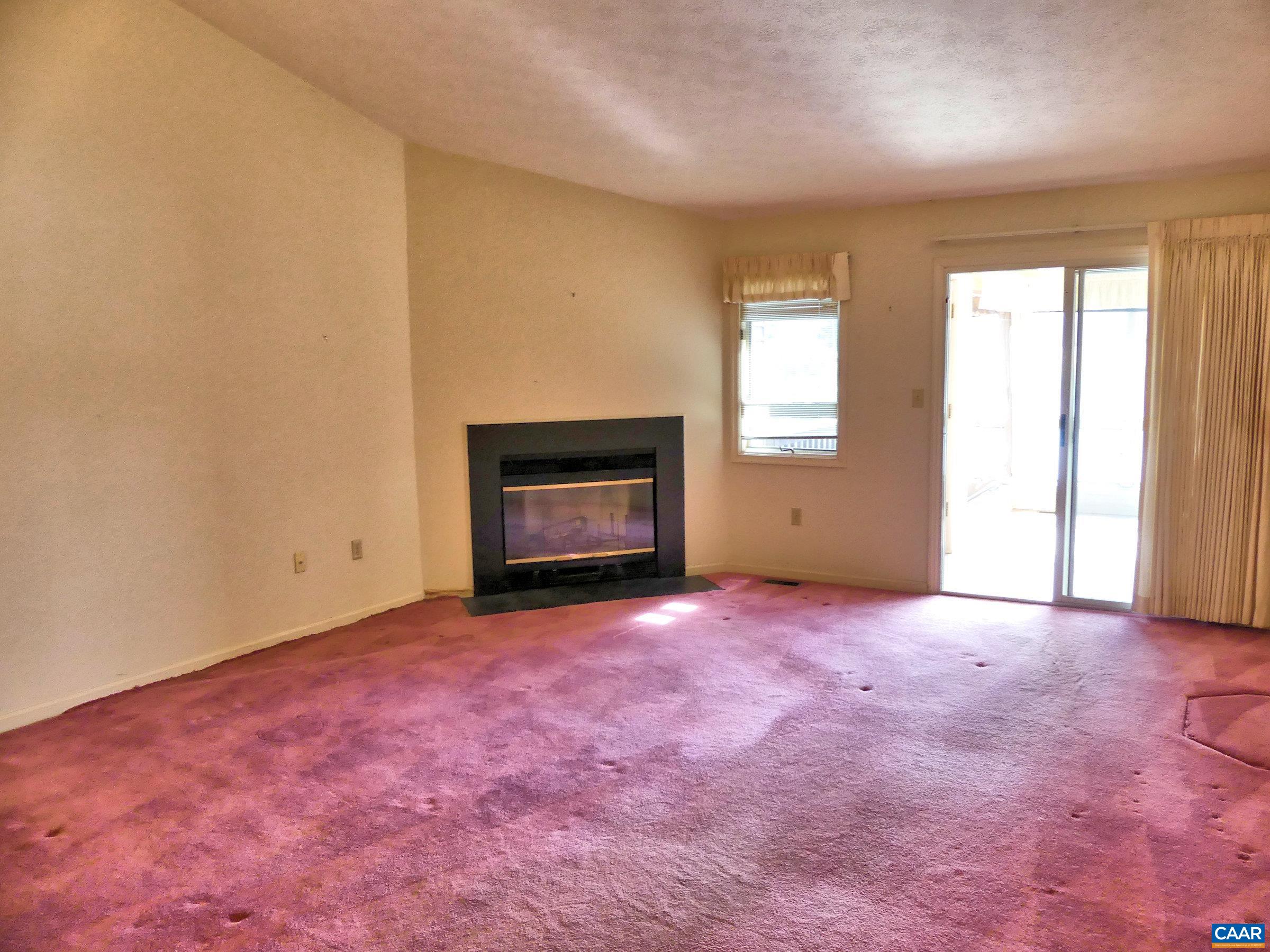 2 Marina Point Palmyra, VA 22963 - Photo 9 of 32 an empty room with windows and fireplace