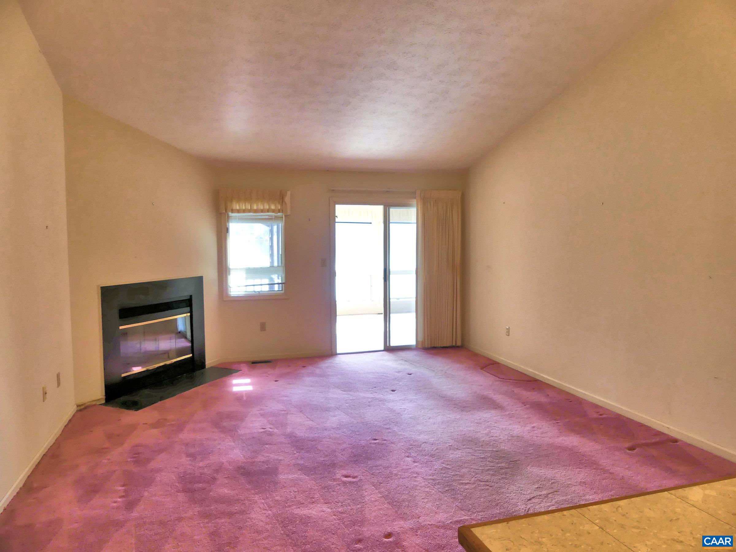 2 Marina Point Palmyra, VA 22963 - Photo 10 of 32 a view of an empty room with a fireplace and a window