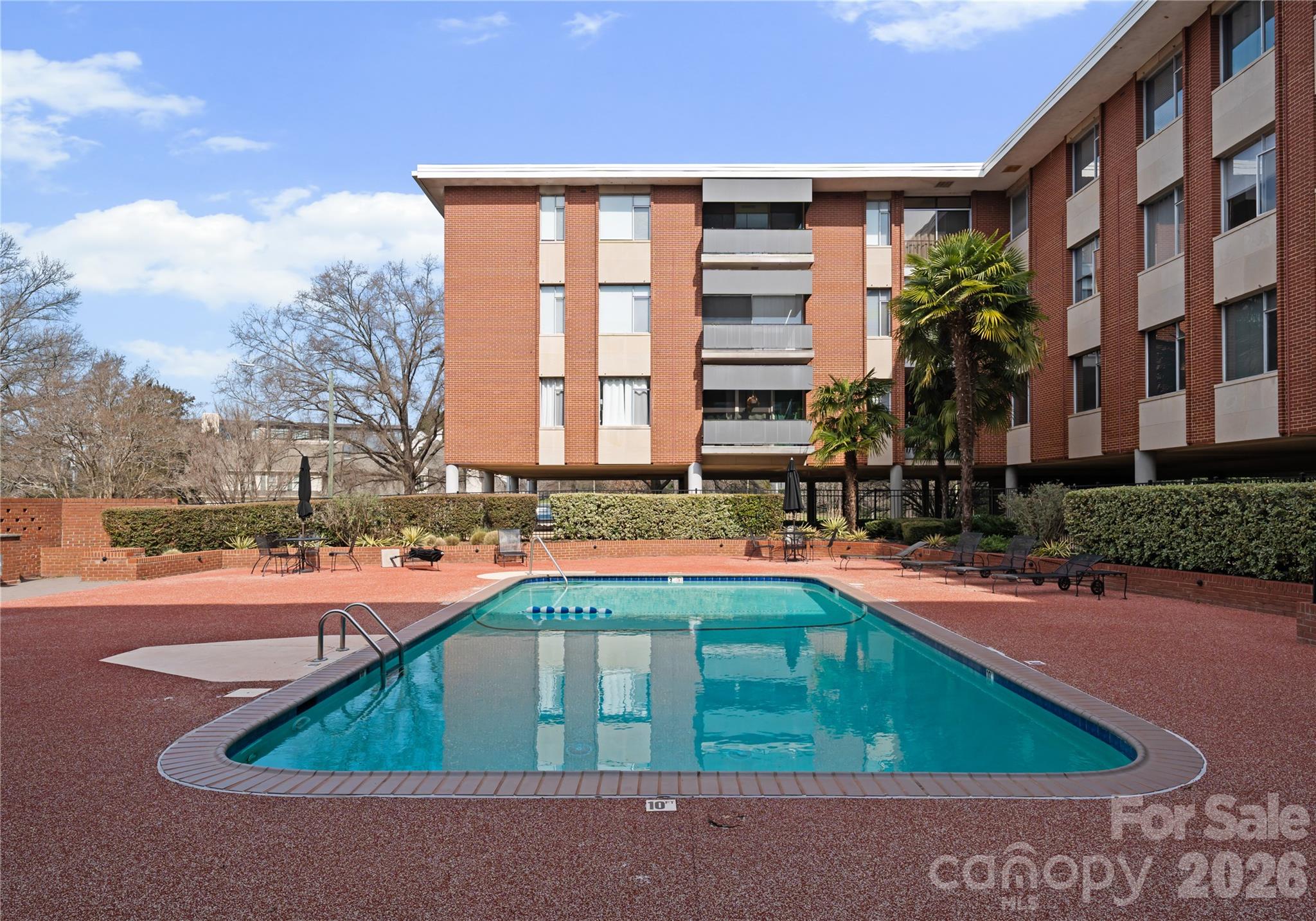 a front view of a house with basket ball court and outdoor seating