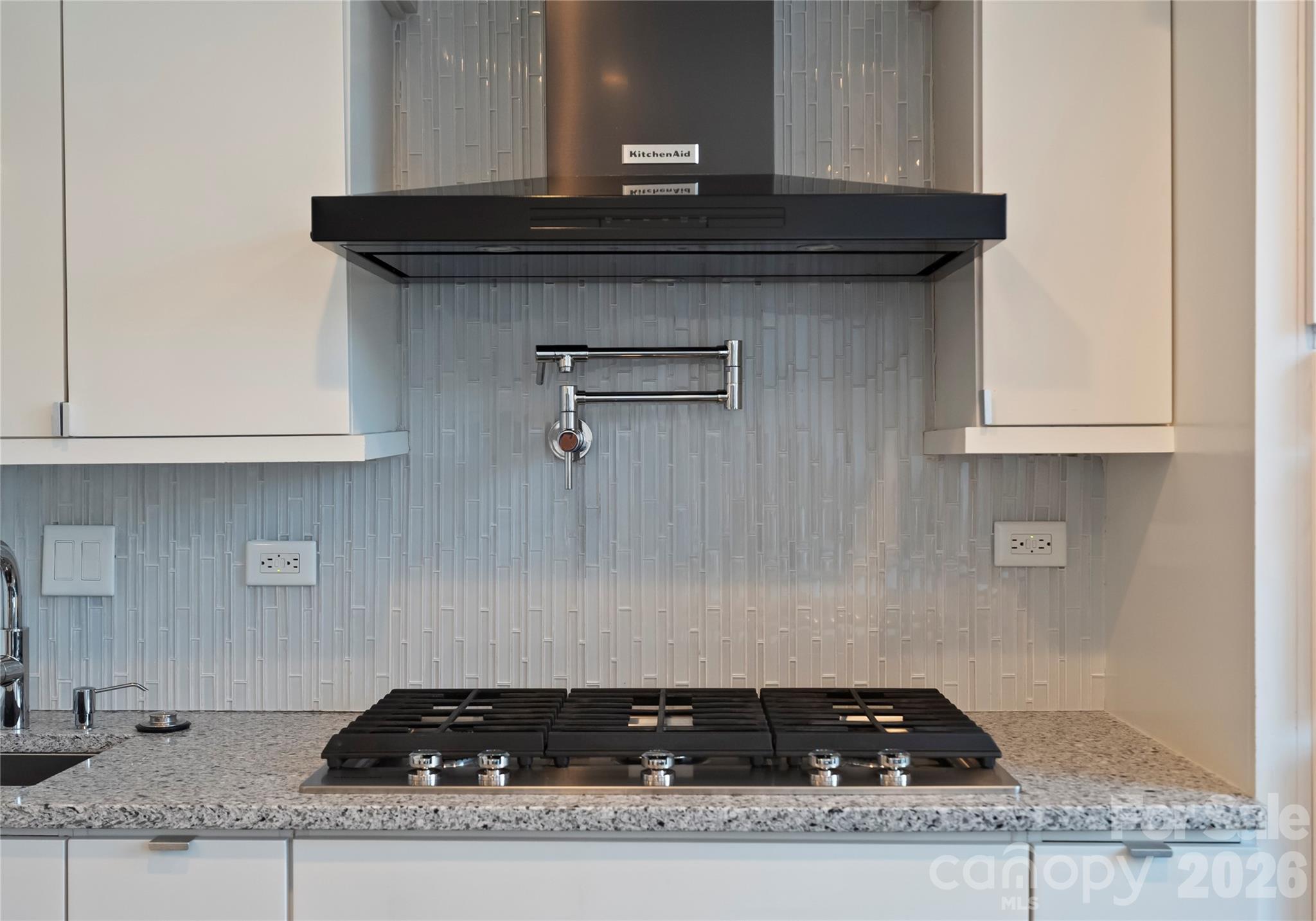 1300 Queens Road Charlotte, NC 28207 - Photo 21 of 45 a close view of a stove a microwave and cabinets