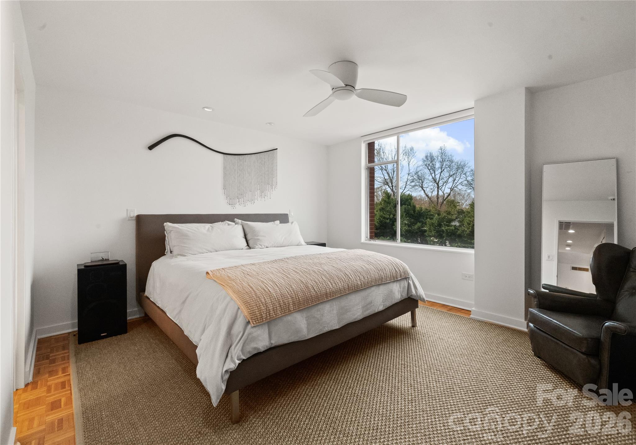 1300 Queens Road Charlotte, NC 28207 - Photo 22 of 45 a bedroom with a bed and a couch
