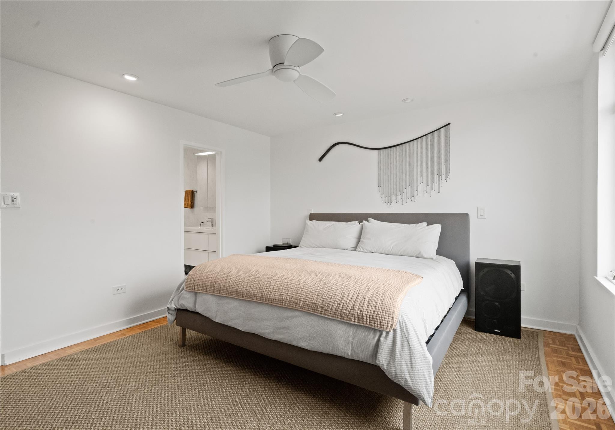 1300 Queens Road Charlotte, NC 28207 - Photo 24 of 45 a bedroom with a bed and a night stand