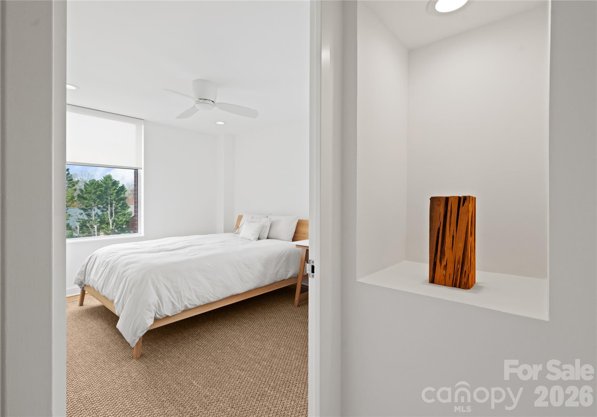 1300 Queens Road Charlotte, NC 28207 - Photo 34 of 45 a bed room with a bed and painting on the wall