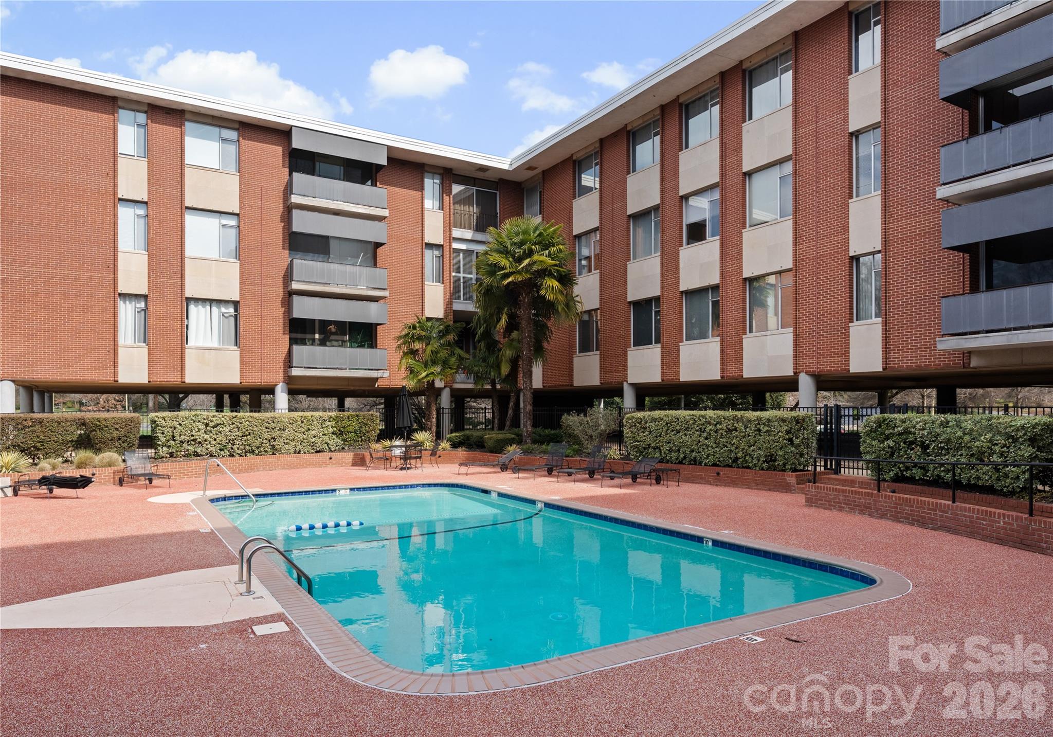 1300 Queens Road Charlotte, NC 28207 - Photo 38 of 45 a view of a house with swimming pool and sitting area