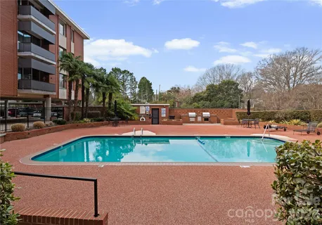 a view of pool with outdoor seating