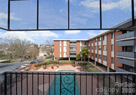 a view of a swimming pool with chairs