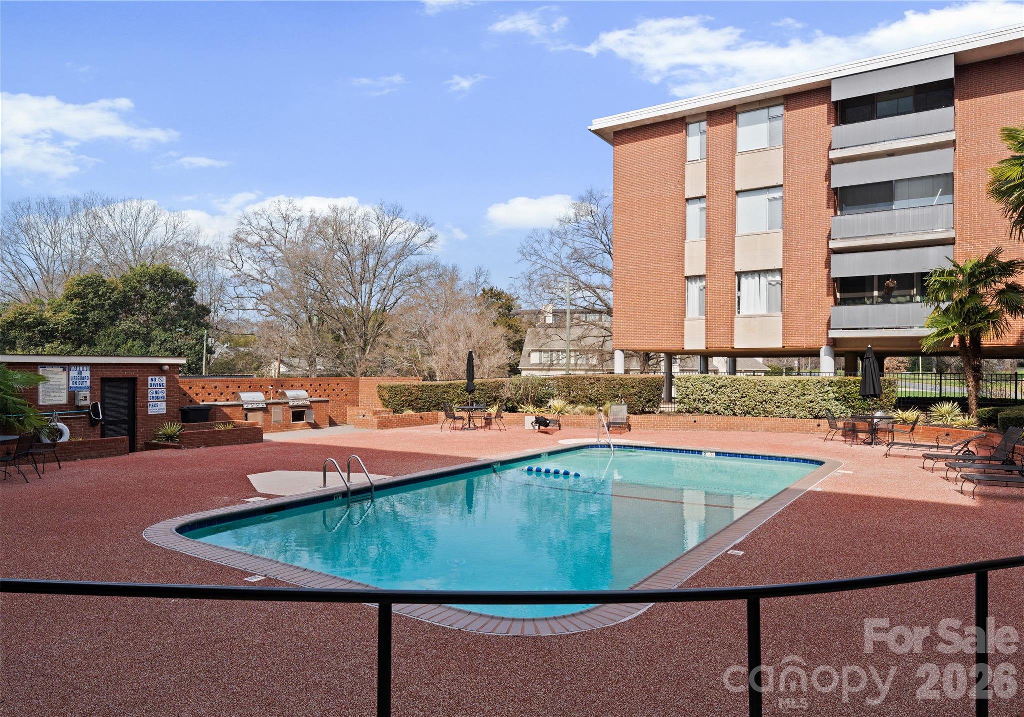1300 Queens Road Charlotte, NC 28207 - Photo 42 of 45 a view of a swimming pool with chairs