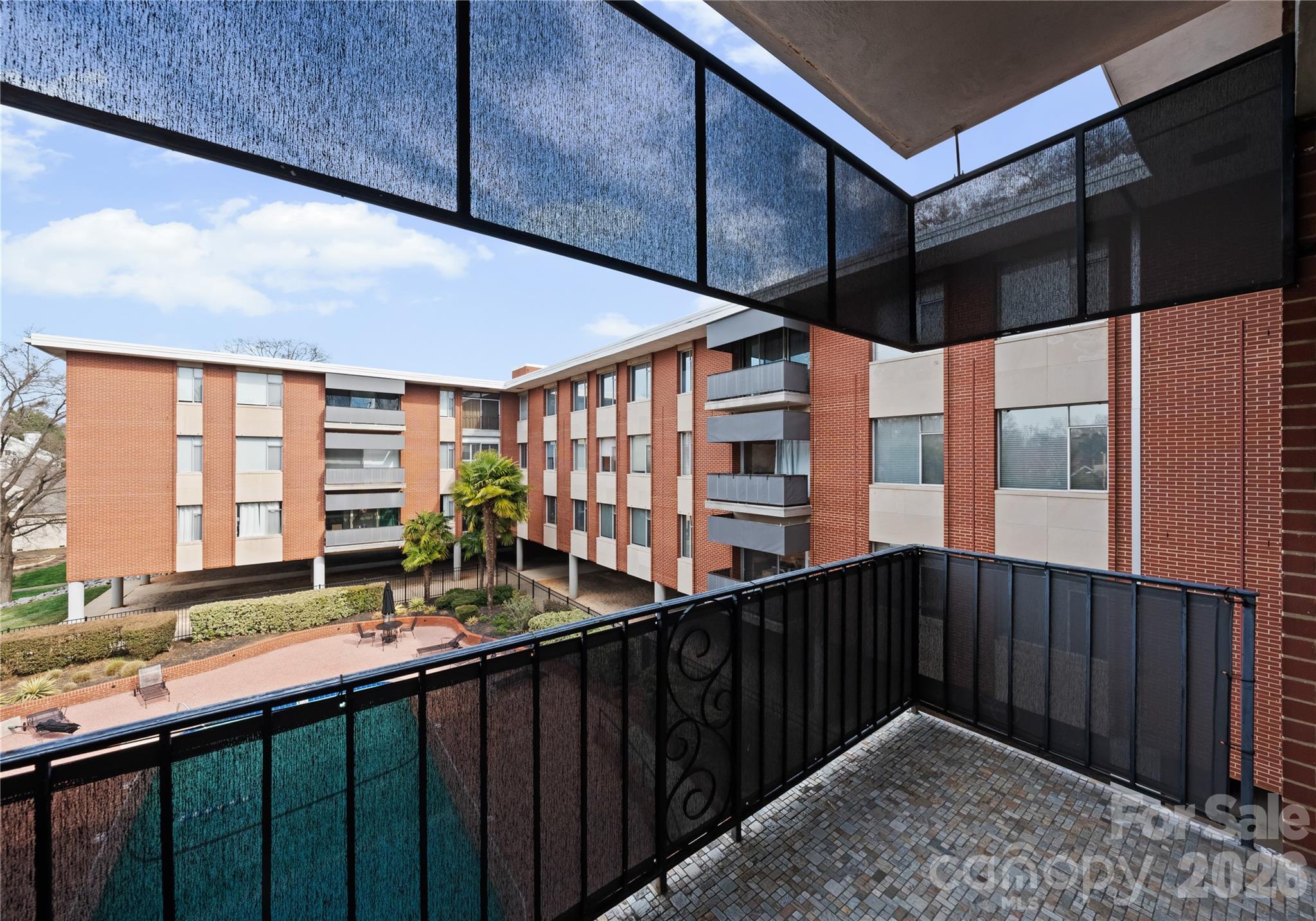 1300 Queens Road Charlotte, NC 28207 - Photo 44 of 45 a kitchen with stainless steel appliances a sink and cabinets