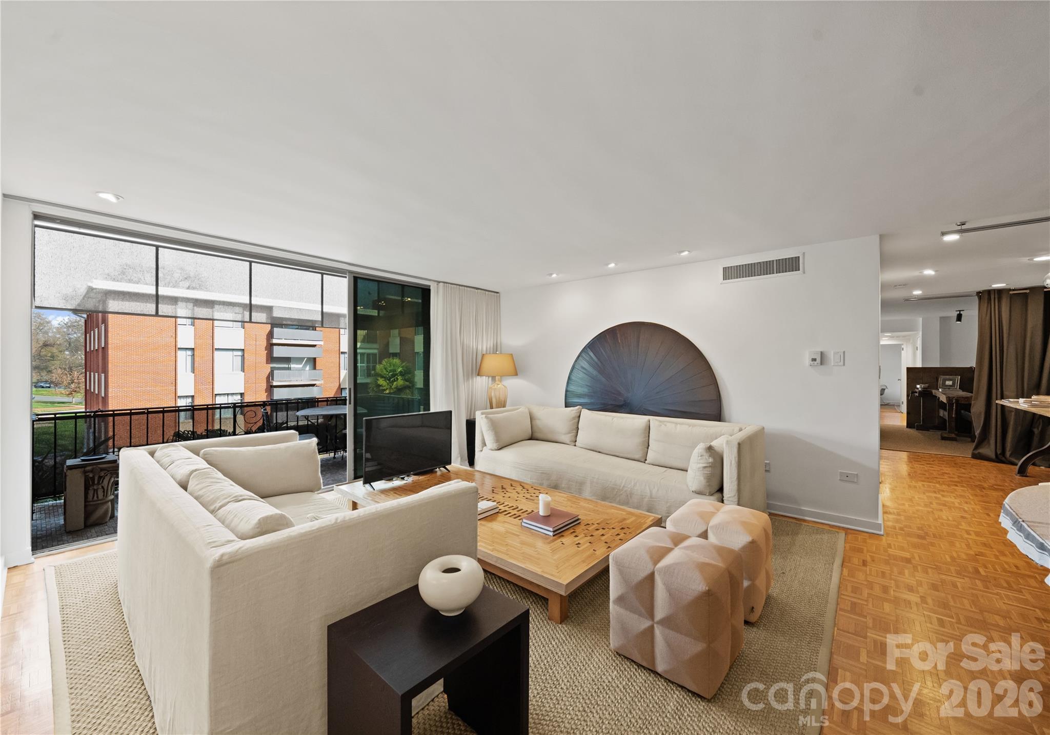 1300 Queens Road Charlotte, NC 28207 - Photo 6 of 45 a living room with furniture and a large window