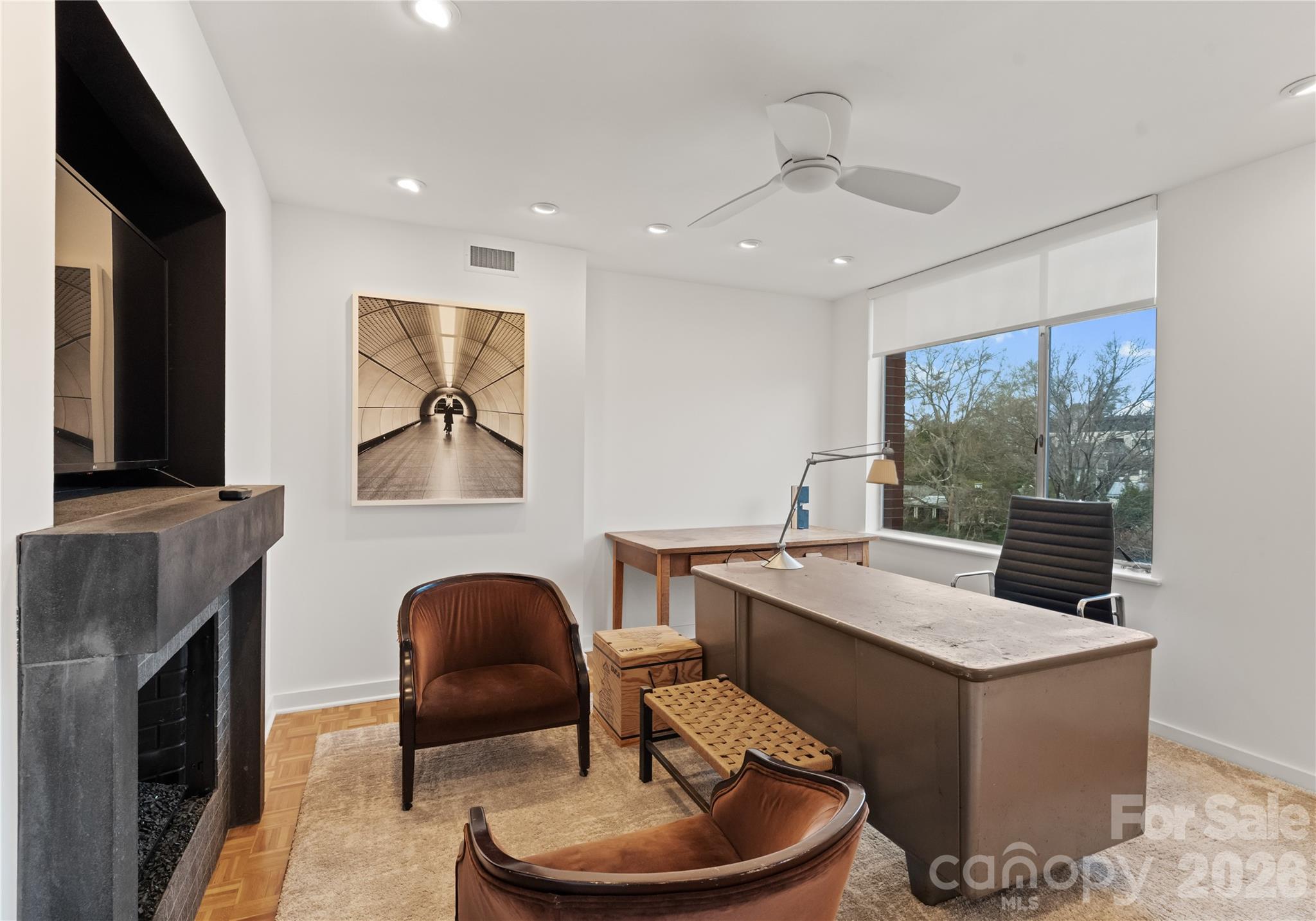 1300 Queens Road Charlotte, NC 28207 - Photo 10 of 45 a living room with furniture a flat screen tv and a fireplace