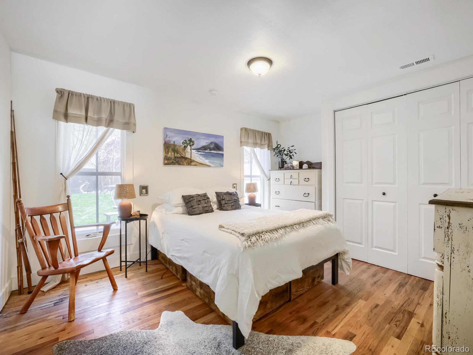 407 Seventh Street Georgetown, CO 80444 - Photo 13 of 28 a bedroom with a bed a table and chair