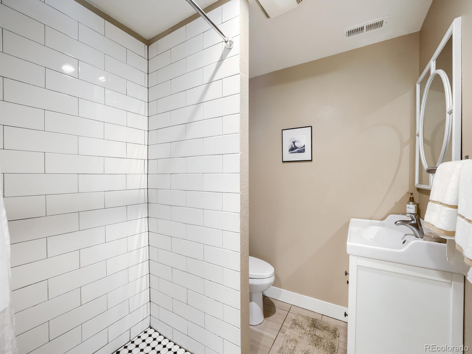 407 Seventh Street Georgetown, CO 80444 - Photo 16 of 28 a bathroom with a shower and toilet