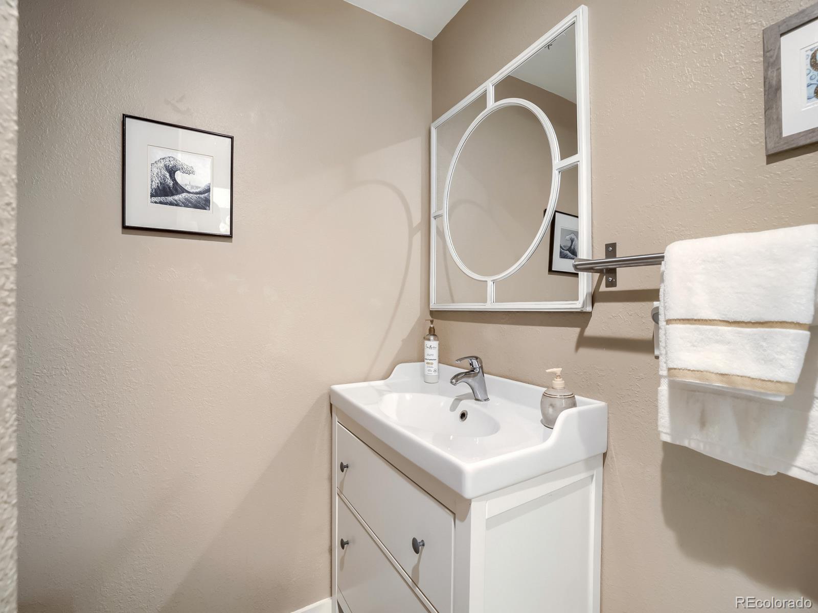 407 Seventh Street Georgetown, CO 80444 - Photo 17 of 28 a bathroom with a sink and a mirror