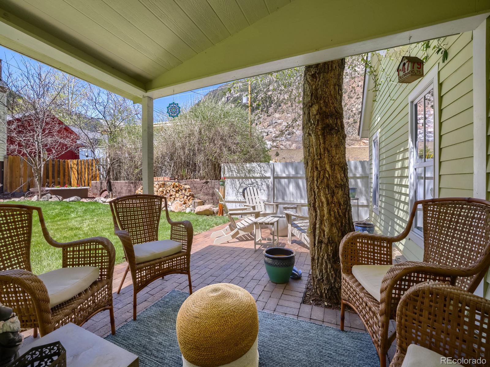 407 Seventh Street Georgetown, CO 80444 - Photo 21 of 28 a living room with furniture and a floor to ceiling window
