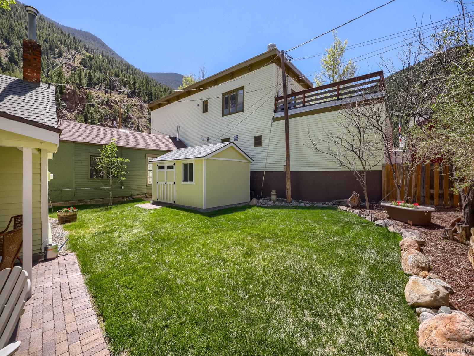 407 Seventh Street Georgetown, CO 80444 - Photo 22 of 28 a view of a house with a backyard