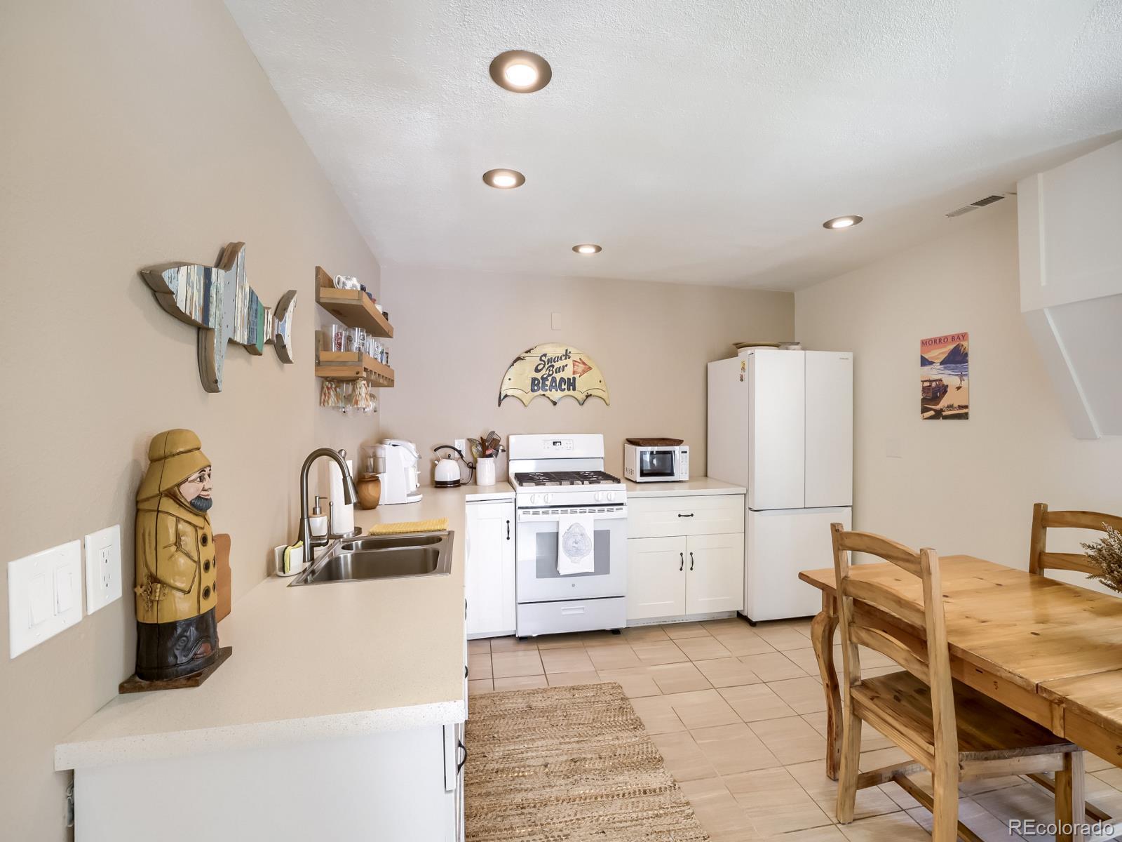 407 Seventh Street Georgetown, CO 80444 - Photo 6 of 28 a kitchen with a white stove top oven and refrigerator