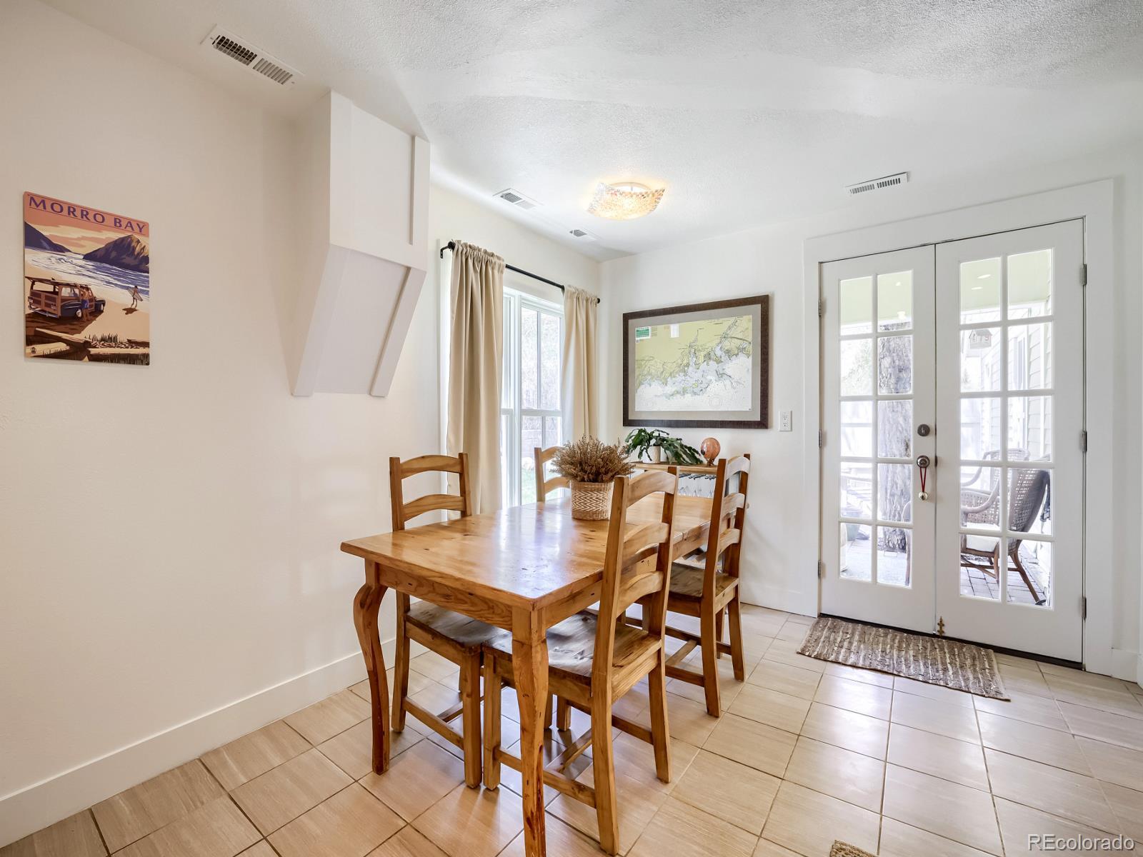 407 Seventh Street Georgetown, CO 80444 - Photo 9 of 28 a view of a dining room with furniture and a potted plant
