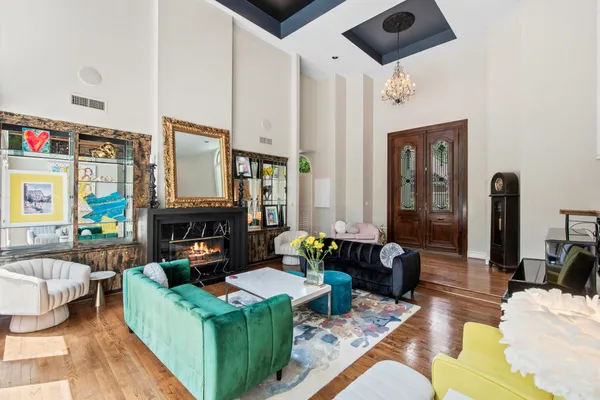 a living room with fireplace furniture and a fireplace