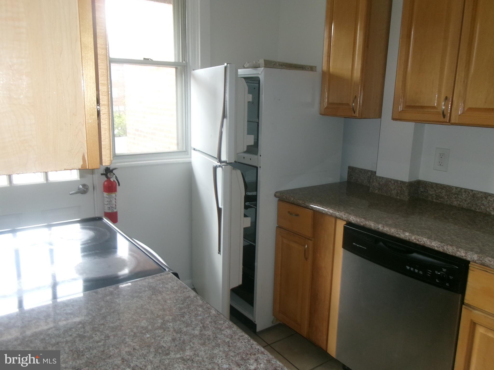 200 Wembly Road Upper Darby, PA 19082 - Photo 19 of 47 a kitchen with a refrigerator and a sink