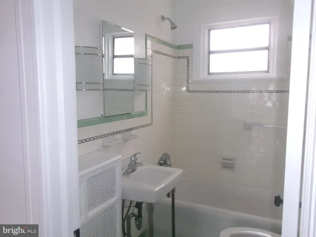 a bathroom with a toilet and a sink