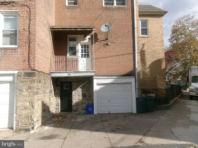a front view of a house with a garage