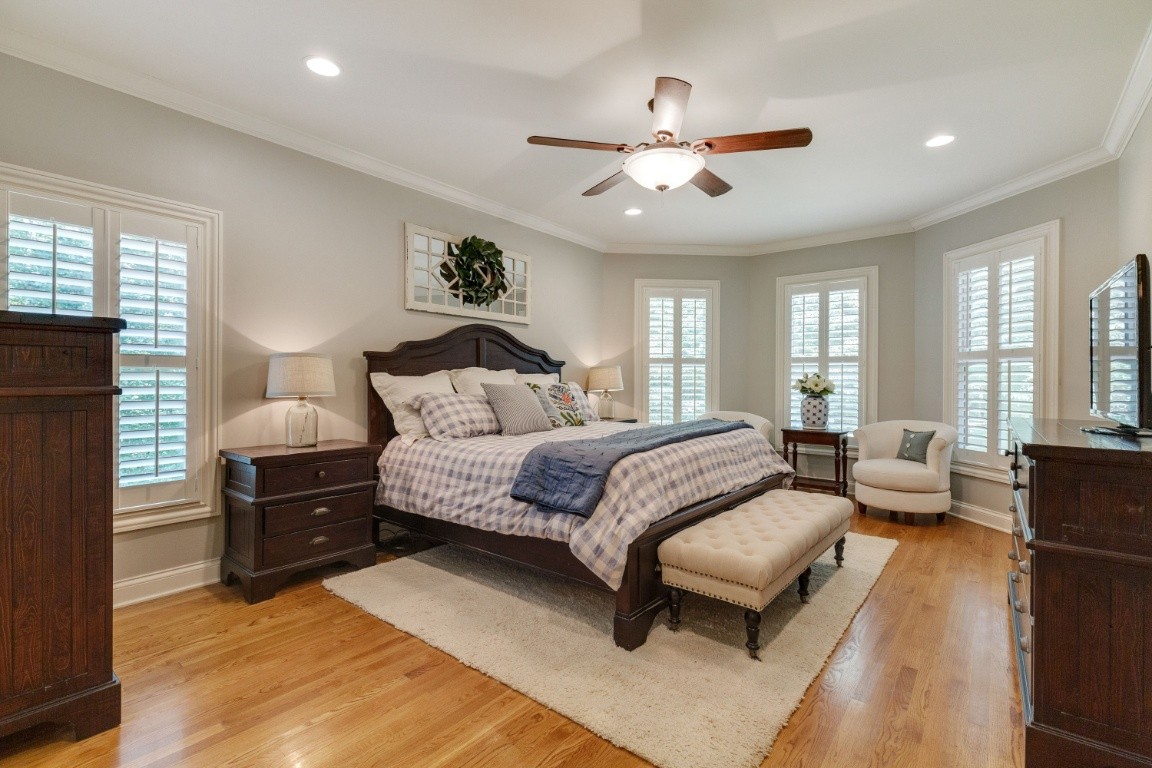 5660 Pinewood Road Franklin, TN 37064 - Photo 17 of 45 a bedroom with a bed and wooden floor