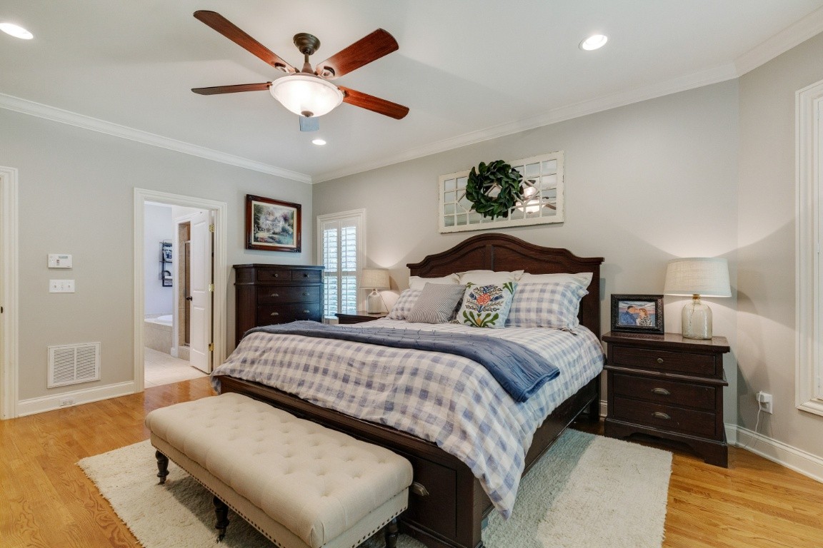5660 Pinewood Road Franklin, TN 37064 - Photo 18 of 45 a bedroom with a bed and ceiling fan